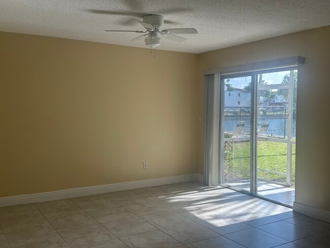 Living room with Pool and Lake Views - 21121 SW 85th Ave Unit The Cove at Cutler Bay