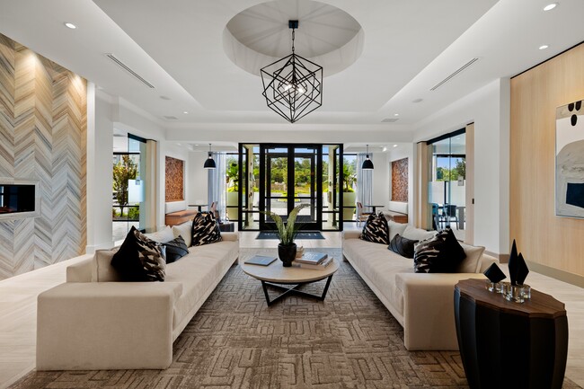 Resident lobby with cozy fireplace and ample seating ideal for remote working