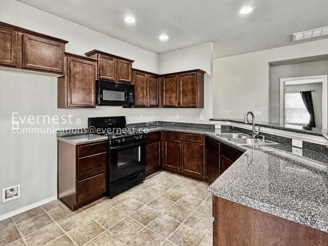 Photo - 3 Bed/2 Bath Home with Fenced Yard & Garage / Pet-Friendly / Available Soon!