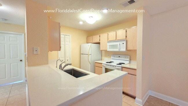 Photo - MOVE IN READY! LARGE 2 BEDROOM/2 BATH PLUS ATTACHED GARAGE! TILE/LVP THROUGHOUT!
