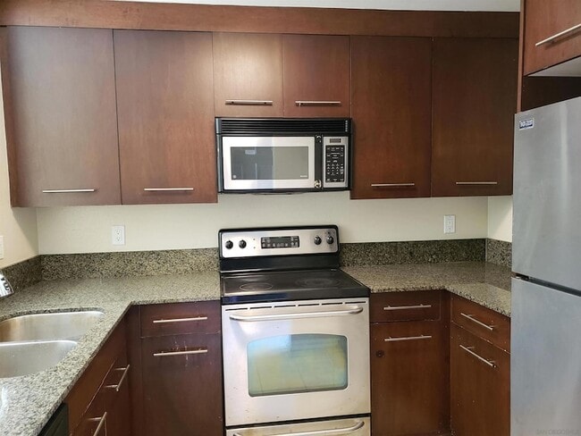 Building Photo - 7425 Charmant Dr Unit 2601