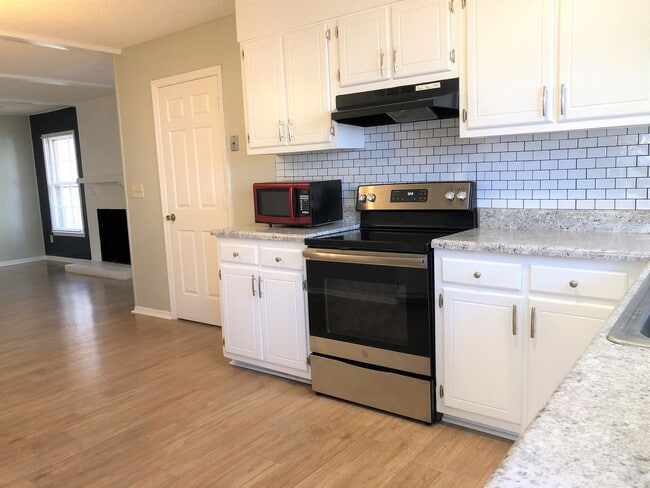 Photo - SW Large Brick Home, Updated Kitchen & Bathrooms, Wood Like Flooring, Fenced Yard!