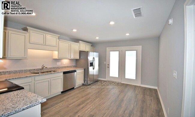 Photo - Beautiful 3BR/2.5BA+Bonus luxury townhome! Attached garage AND washer/dryer included!