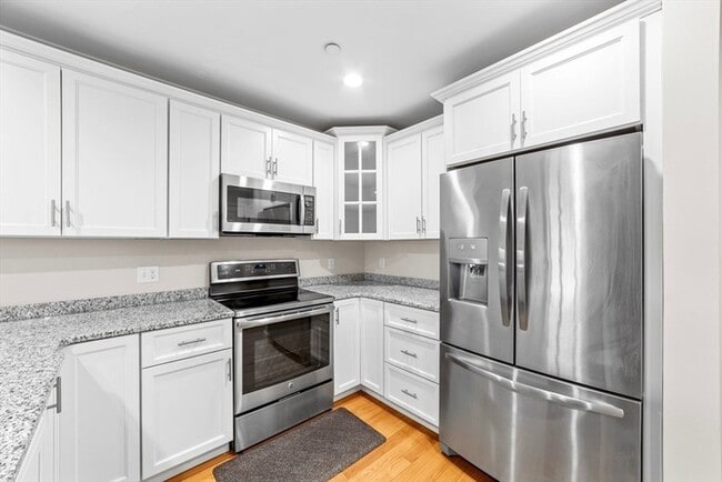 Photo - Top-Floor 2BR Condo with Balcony, Garage Parking & Amenities in Lexington Unit 244