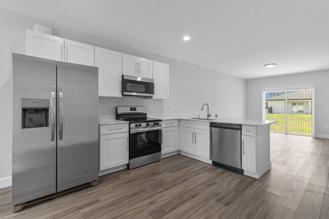 Photo - "Charming 3-Bed, 2-Bath Duplex Gem in Port Charlotte - Your Ideal Home Awaits!"
