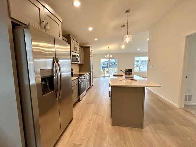 Photo - Spacious & Stylish 4-Bed Home with Modern Finishes and Attached 2-Stall Garage