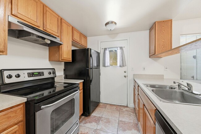 Photo - Spacious 2BD/1.5BA Fremont Townhouse | In-Unit W/D | Community Pool & Hot Tub | Carport Parking