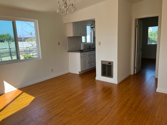 living room facing kitchen and bedroom - 1013 Rosedale Ave Apartments Unit A