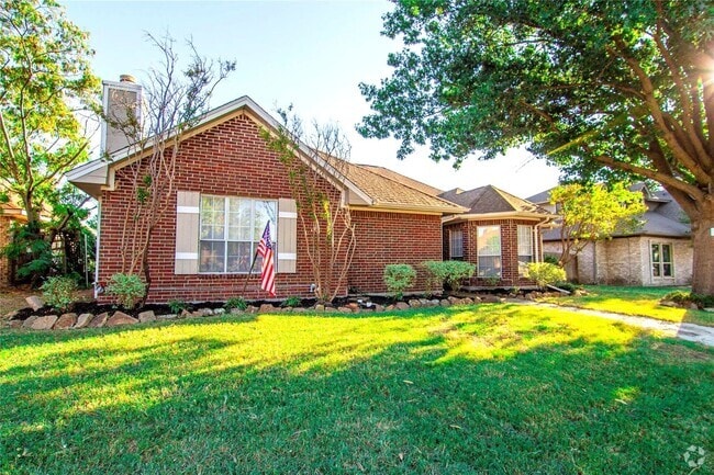 Building Photo - A  spacious three-bedroom, two-bathroom ho... Rental