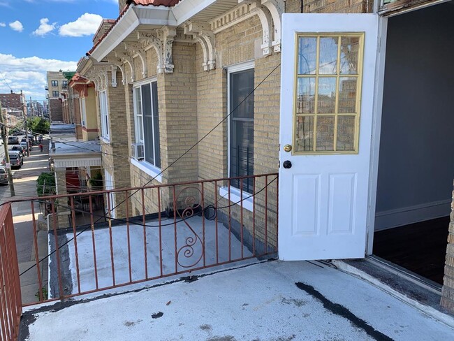 balcony off third bedroom - 127 65th St Apartments Unit 2