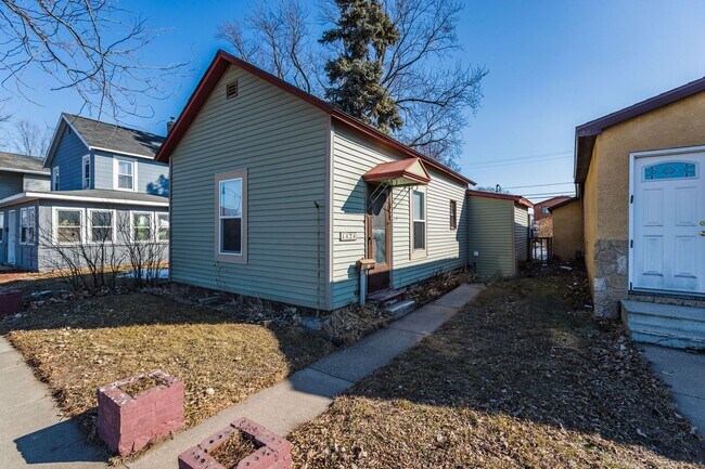 Photo - House w/ Yard and Garage