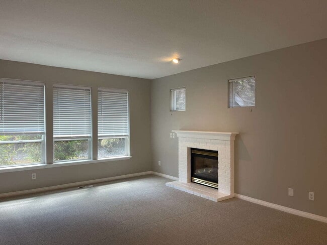 4-Bedroom Happy Valley Home with Large Garage, Spacious Living Areas & Covered Deck