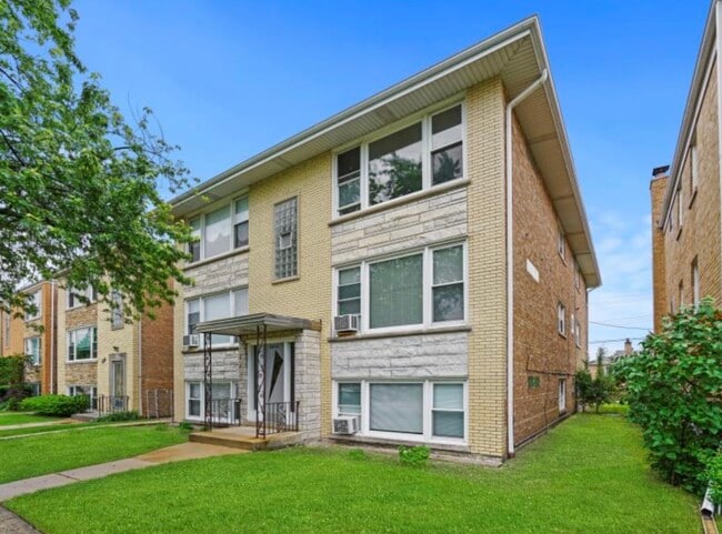 Building Photo - 7651 W Addison St Unit 1w