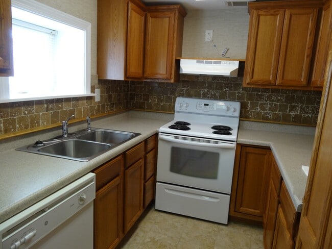 Kitchen has spacious cabinet storage and room for microwave over the stove - 512 Macon Hwy Unit Apt A
