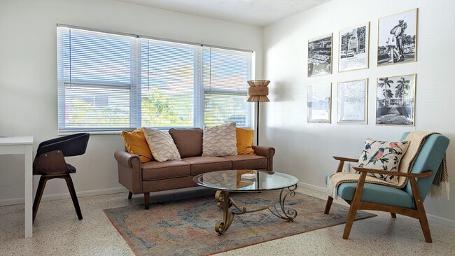 Living room with tons of natural light! - 2846 W Tamiami Cir